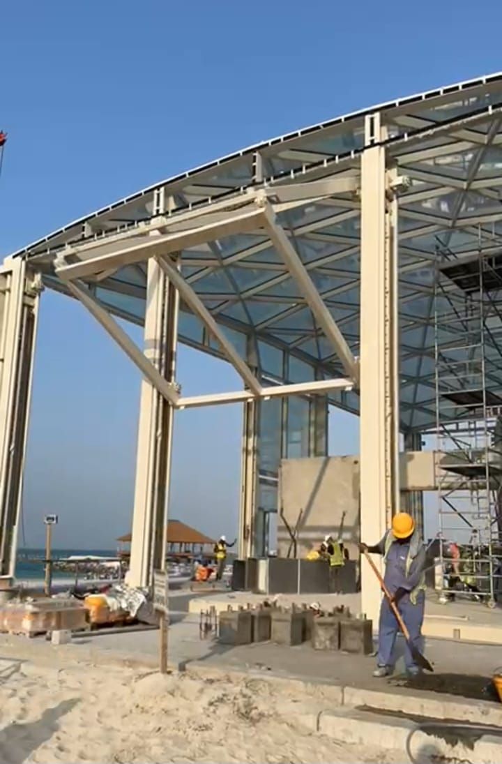 Structural steel portal frame and curved roof structure erected by AL NIMRA